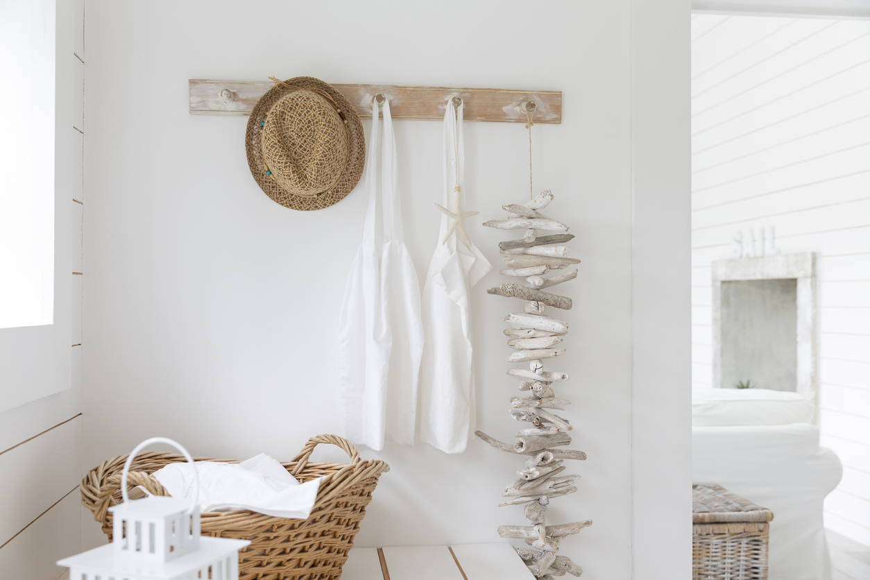 Driftwood and aprons hanging from beach house coat rack
